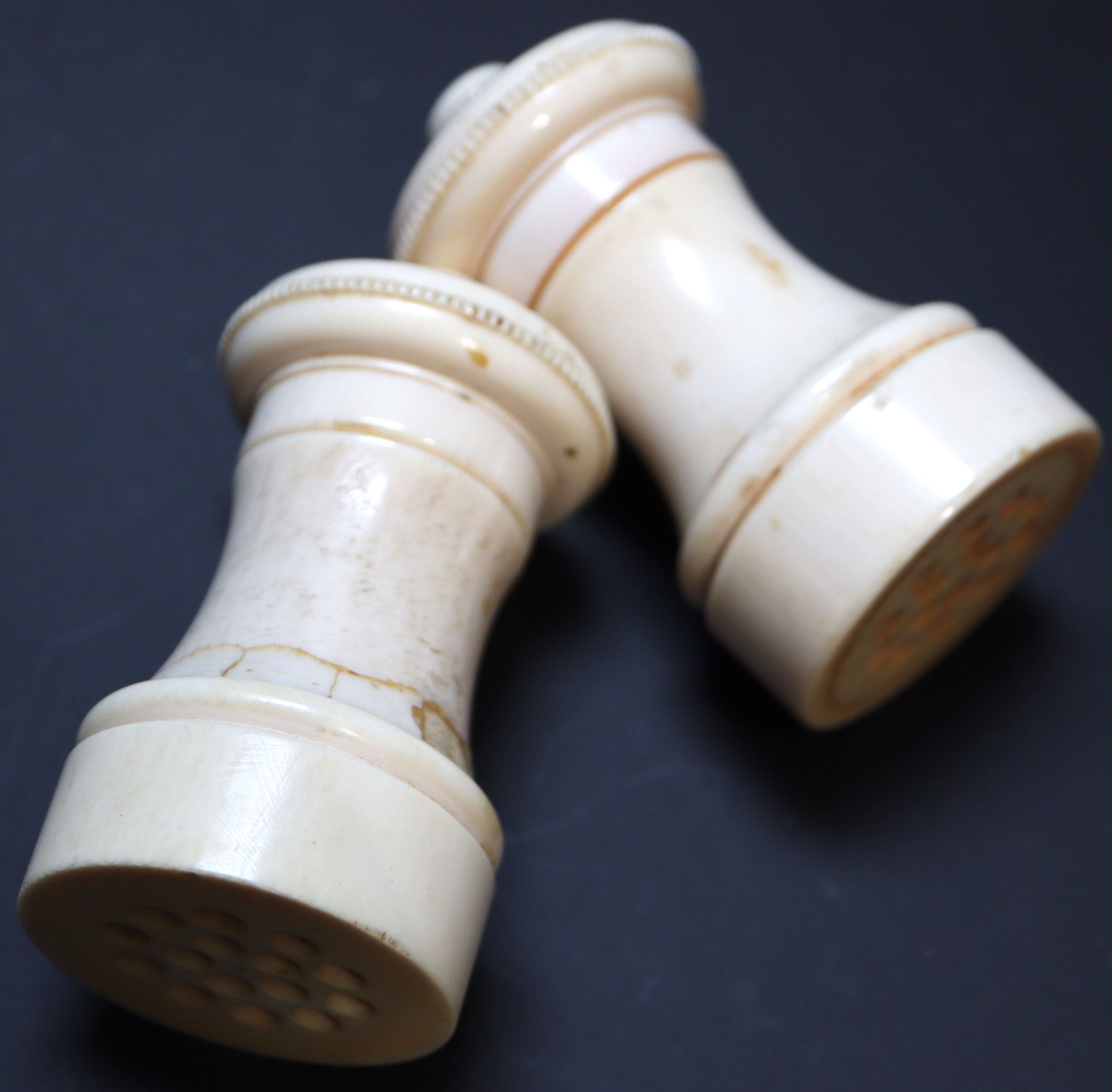 A group of condiments including Chinese and ivory and a table bell